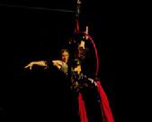 Melina performs a daring combination of Silks, Lyra, and belly dance on air